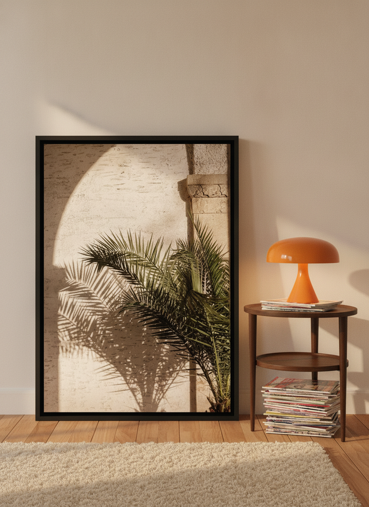 Canvas wall art with a black surround leaning against the wall in a retro 70s home office