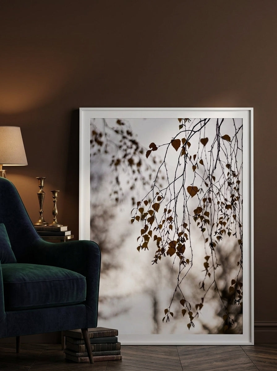 Modern wall art print leaning against the wall in a moody bedroom
