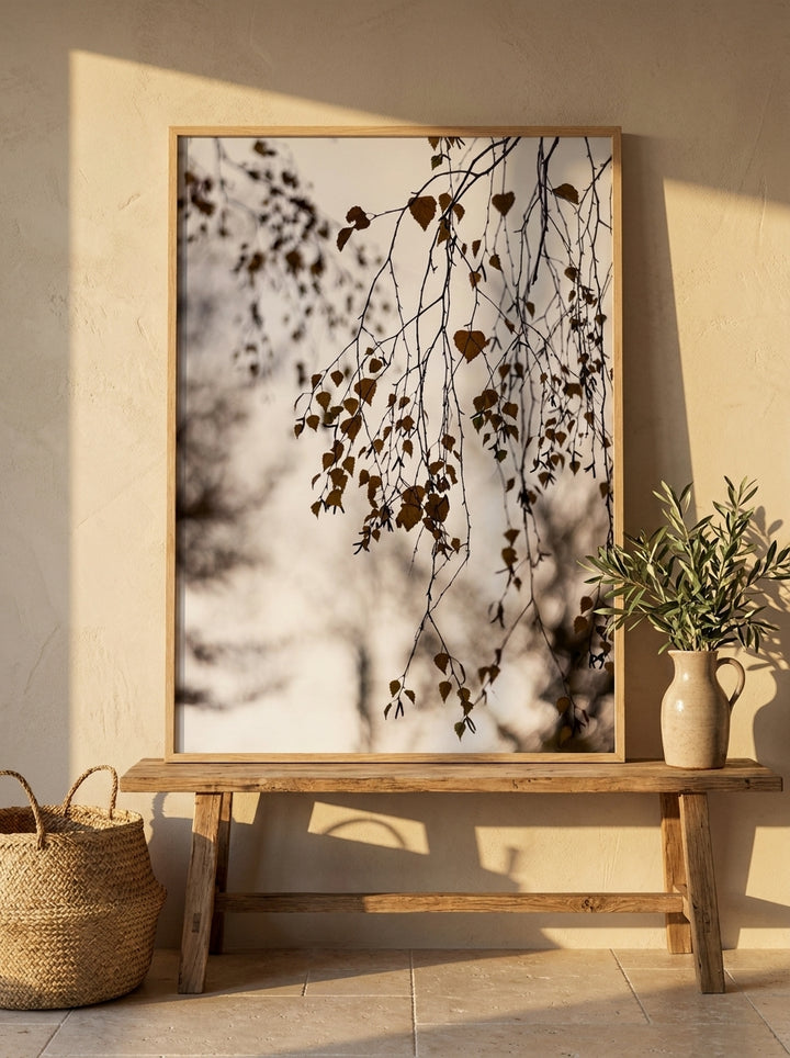 Modern wall art print standing on a bench in a Mediterranean bathroom