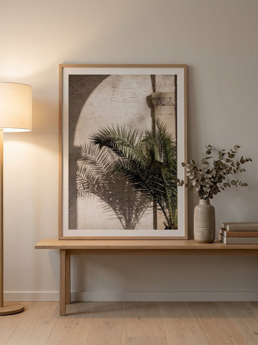 Modern wall art print standing on a bench in a warm Japandi home office