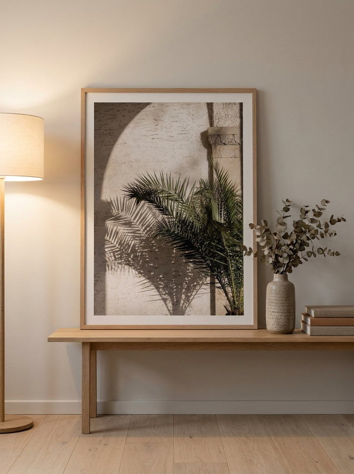Modern wall art print standing on a bench in a warm Japandi home office