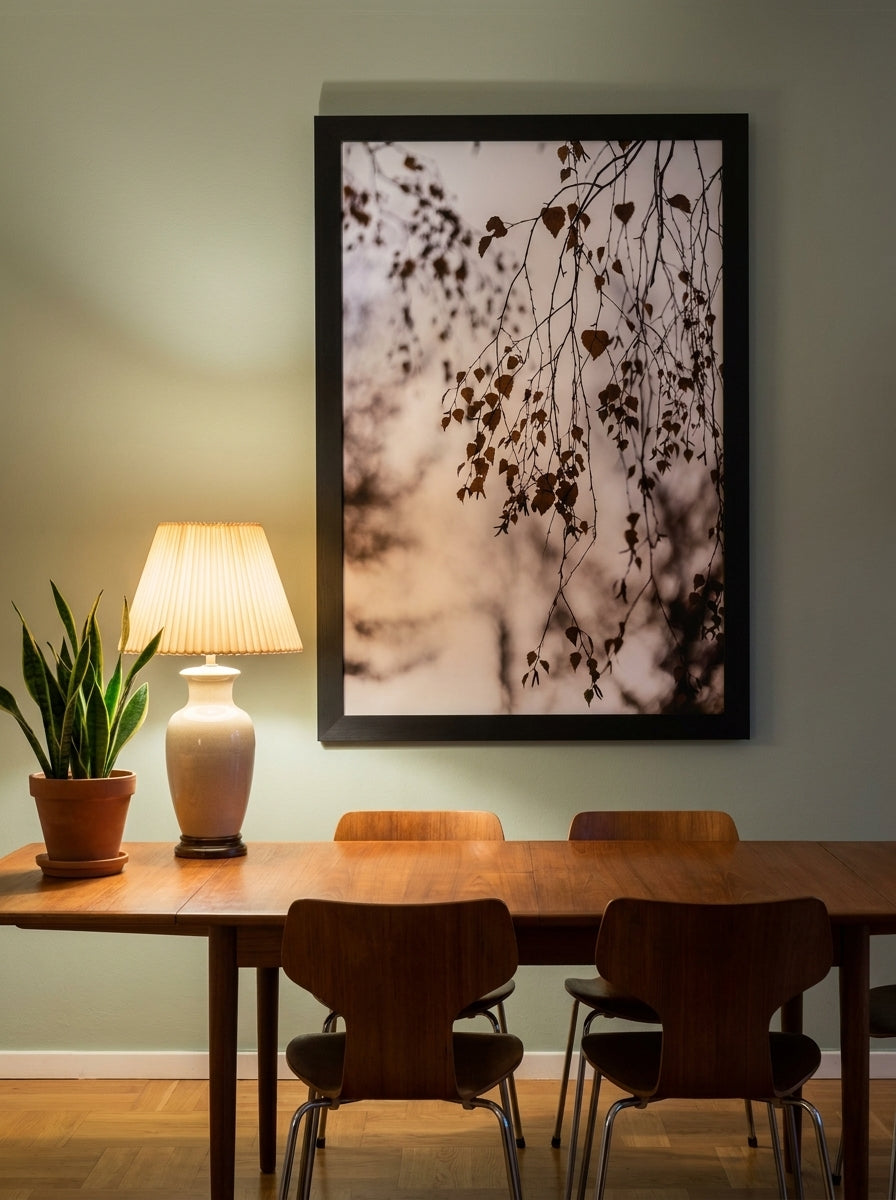 Oversized statement modern wall art print styled on the wall in a mid-century dining room