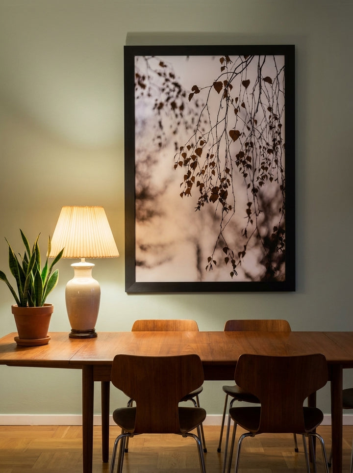 Oversized statement modern wall art print styled on the wall in a mid-century dining room