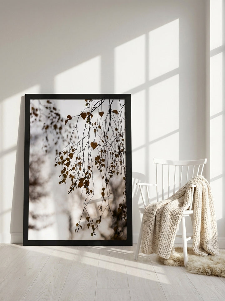 Oversized statement modern wall art print leaning against the wall in a bright Scandinavian living room