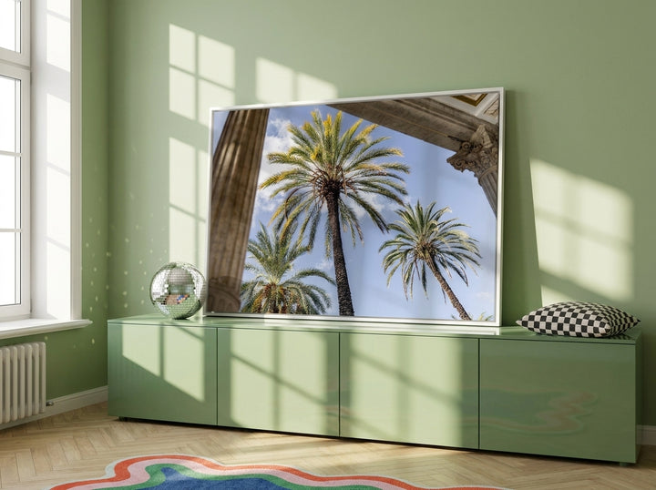 Canvas wall art with a white surround standing on a sideboard in a colourful eclectic dining room