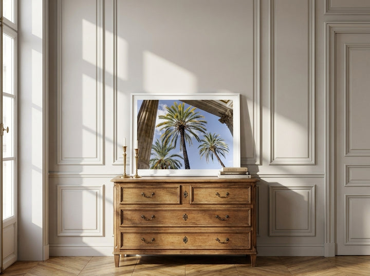 Modern wall art print standing on a sideboard in a Parisian home office