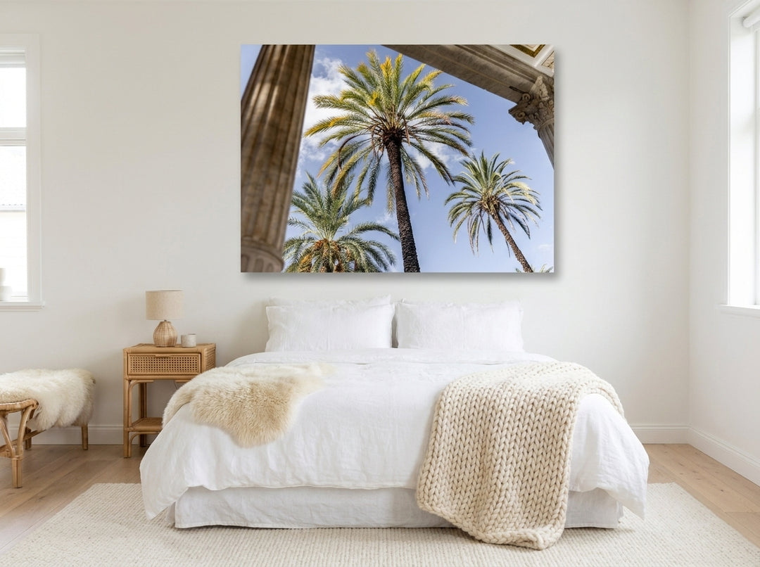Stretched canvas wall art styled on the wall in a bright Scandinavian bedroom
