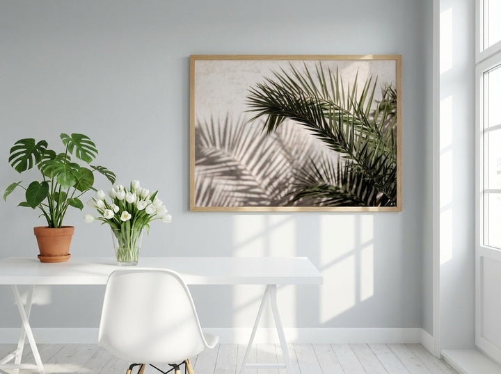 Modern wall art print styled on the wall in a bright Scandinavian home office