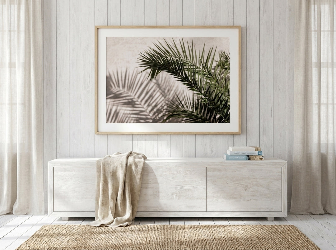 Modern wall art print styled on the wall in a coastal living room