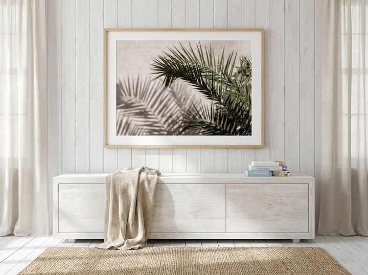 Modern wall art print styled on the wall in a coastal living room