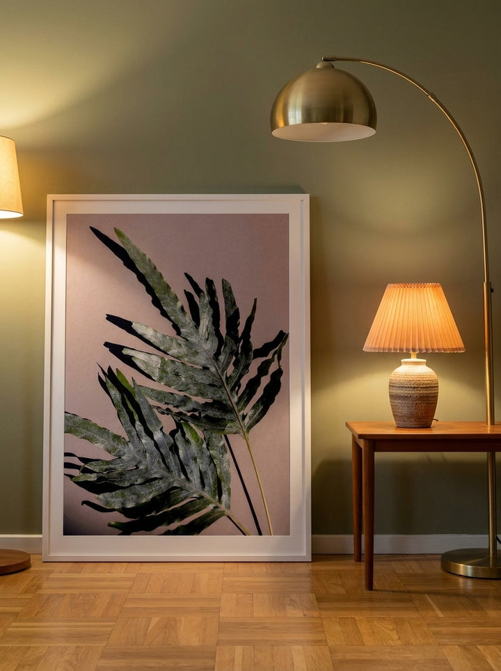 Modern wall art print leaning against the wall in a mid-century living room