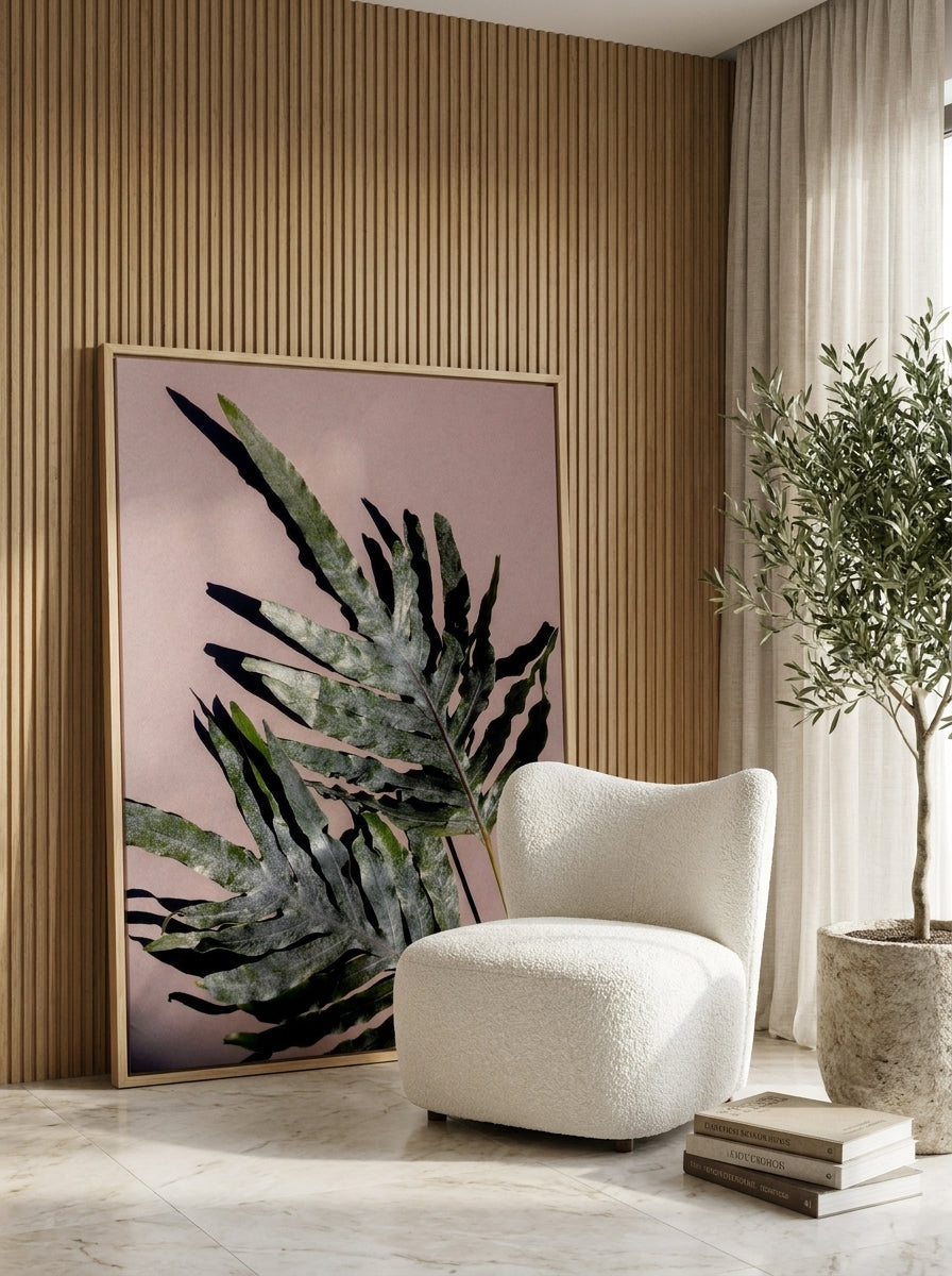 Oversized statement canvas wall art with a natural timber surround leaning against the wall in a luxe bathroom