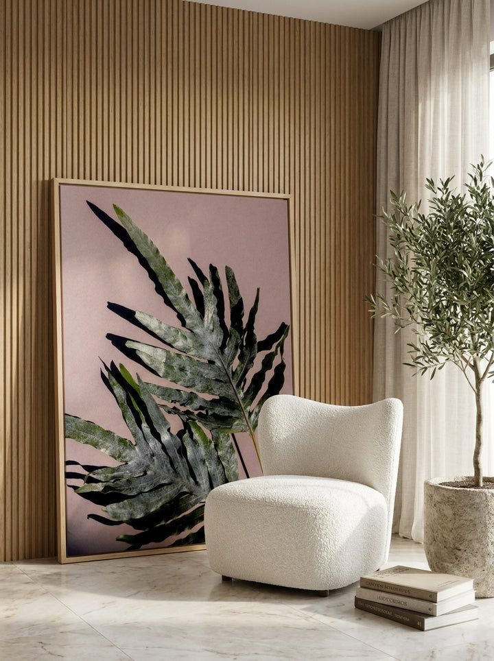 Oversized statement canvas wall art with a natural timber surround leaning against the wall in a luxe bathroom