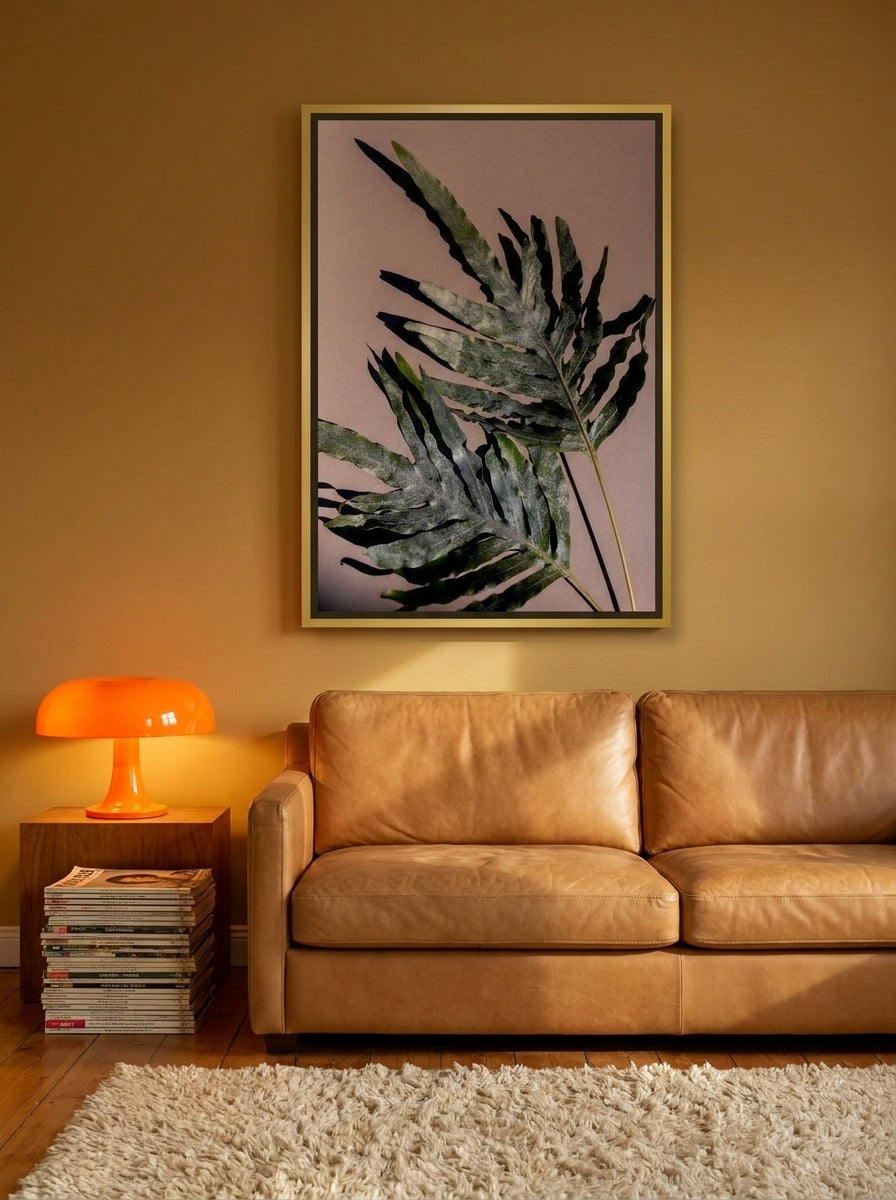 Canvas wall art with a gold leaf surround styled on the wall in a retro 70s living room