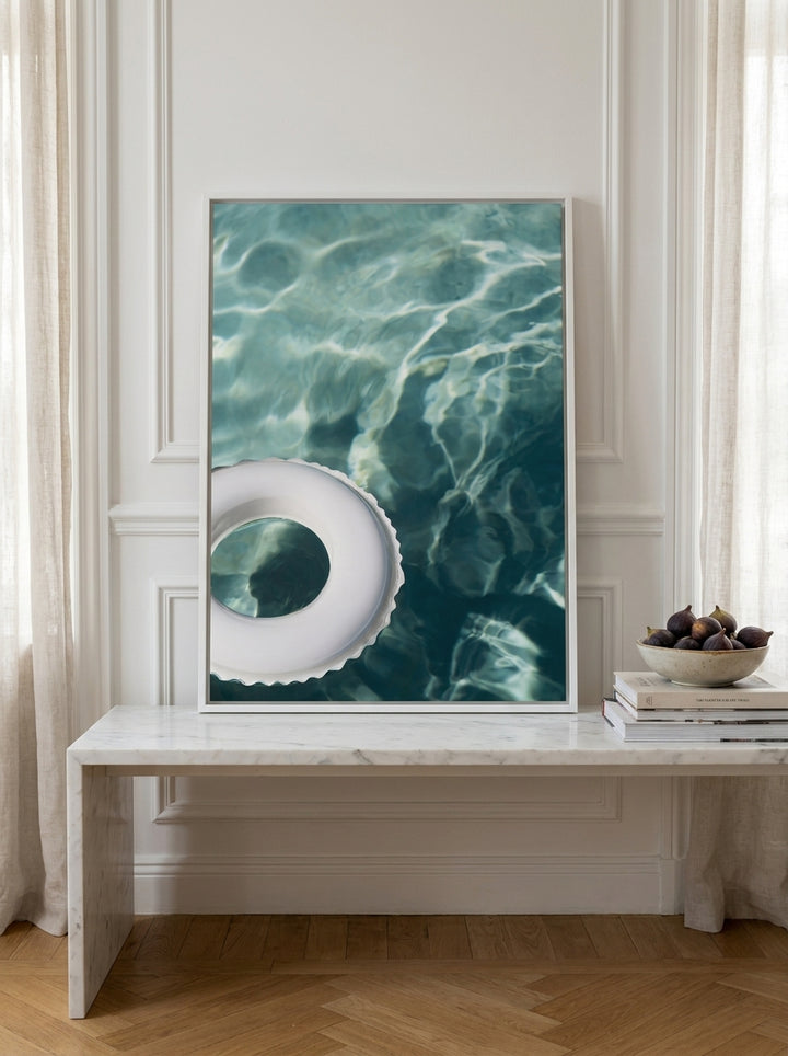 Canvas wall art with a white surround standing on a kitchen bench in a Parisian kitchen