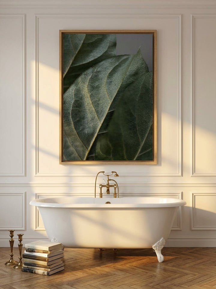 Canvas wall art with a natural timber surround styled on the wall in a Parisian bathroom