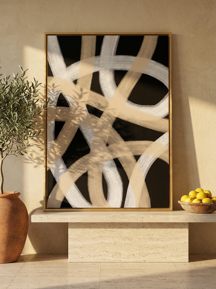 Canvas wall art with a gold leaf surround standing on a console in a Mediterranean living room