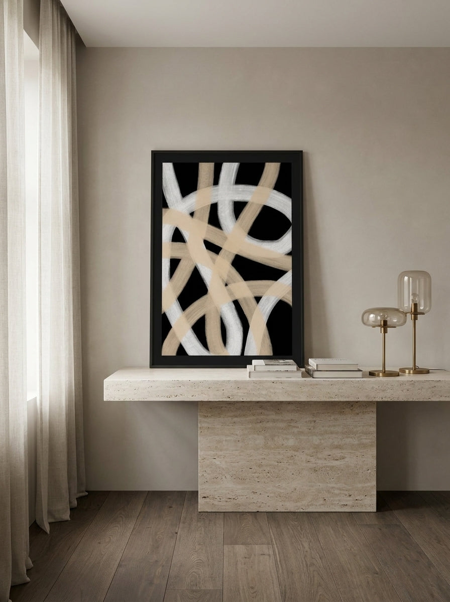 Modern wall art print standing on a console in a luxe home office