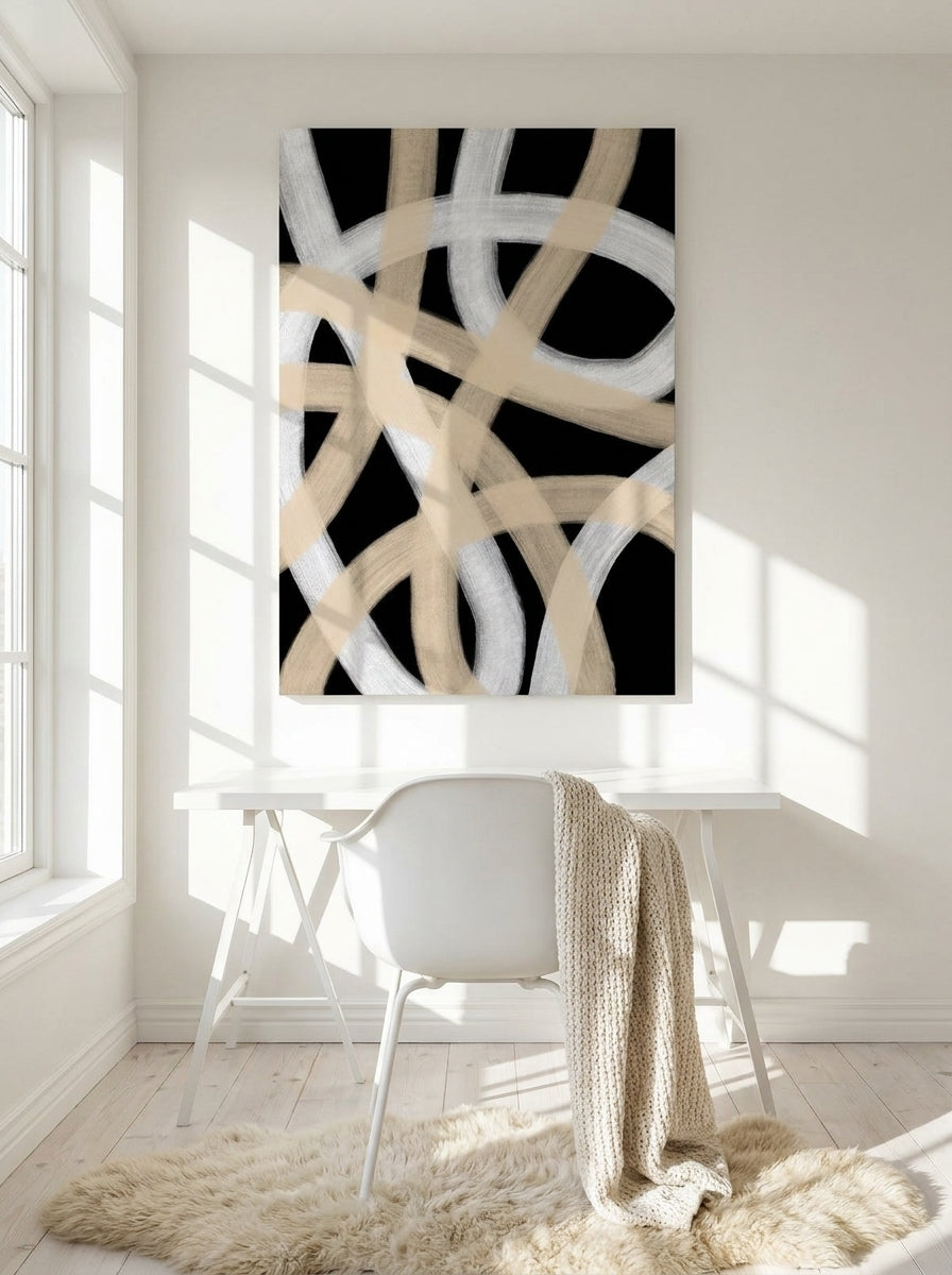 Stretched canvas wall art styled on the wall in a bright Scandinavian home office