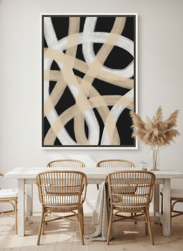 Oversized statement canvas wall art with a white surround styled on the wall in a coastal dining room