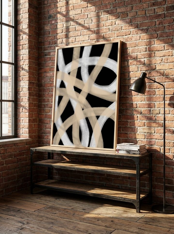 Modern wall art print standing on a console in an industrial loft bedroom