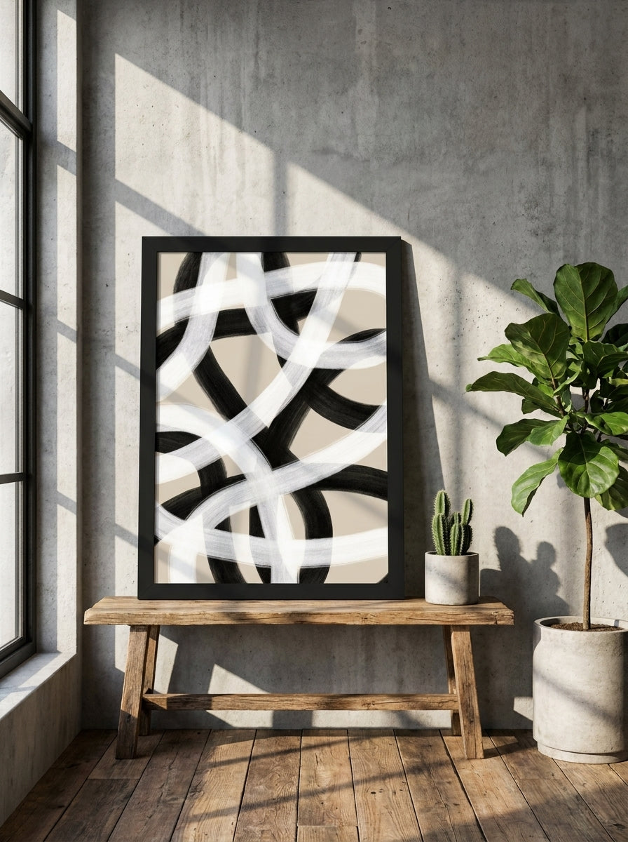 Modern wall art print standing on a bench in an industrial loft living room