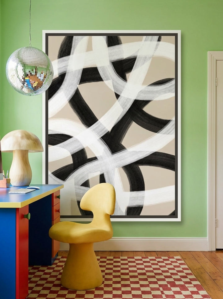 Canvas wall art with a white surround styled on the wall in a colourful eclectic home office