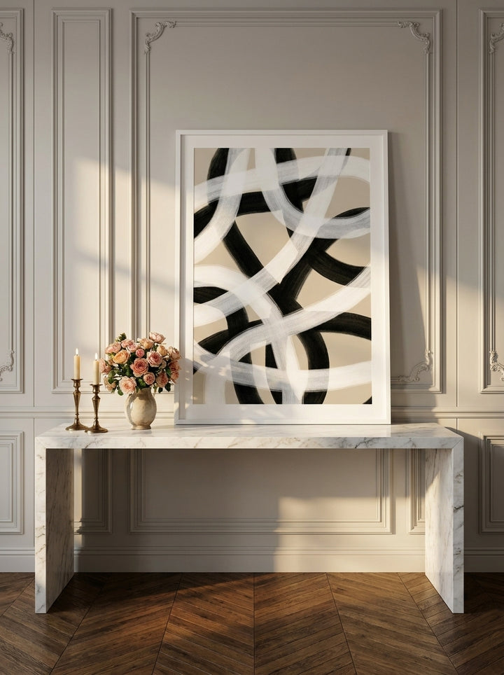 Modern wall art print standing on a console in a Parisian home office