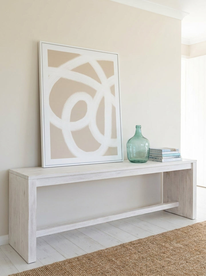 Modern wall art print standing on a console in a coastal home office