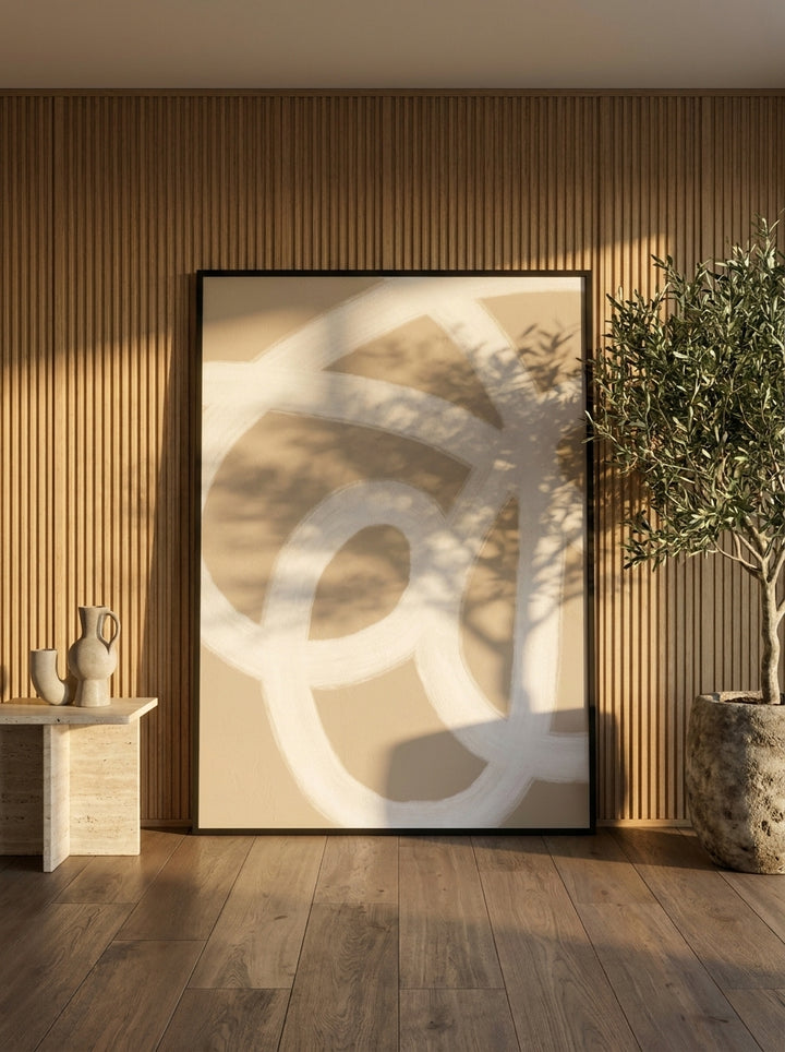 Oversized statement modern wall art print leaning against the wall in a luxe living room