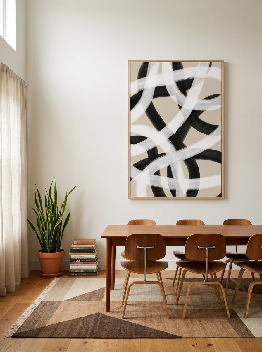 Oversized statement modern wall art print styled on the wall in a mid-century dining room