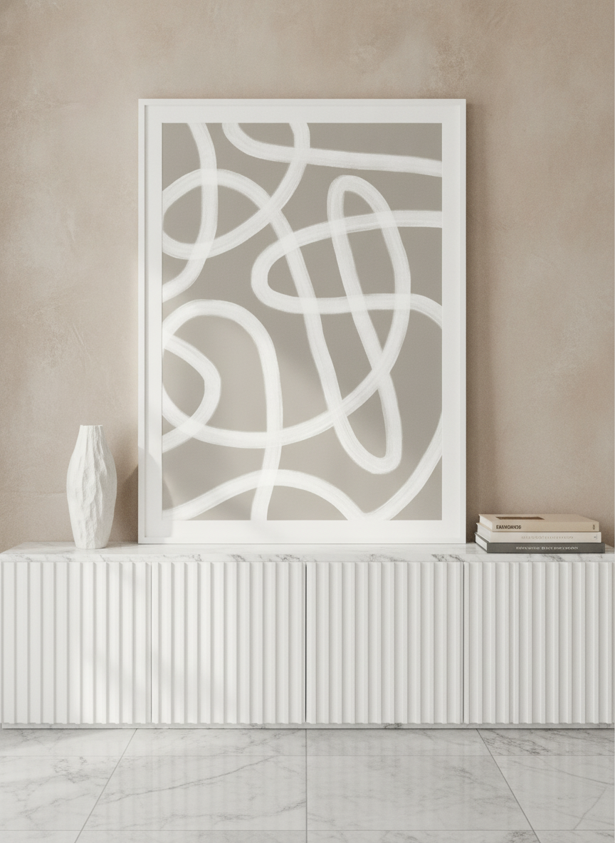 Modern wall art print standing on a sideboard in a luxe home office