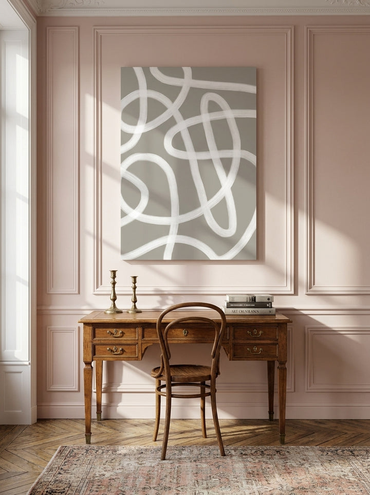 Stretched canvas wall art styled on the wall in a Parisian home office