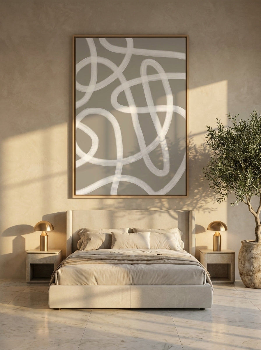 Oversized statement canvas wall art with a natural timber surround styled on the wall in a luxe bedroom