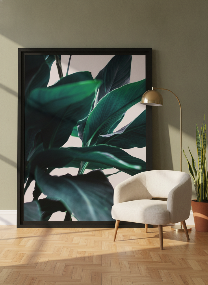 Oversized statement modern wall art print leaning against the wall in a mid-century dining room