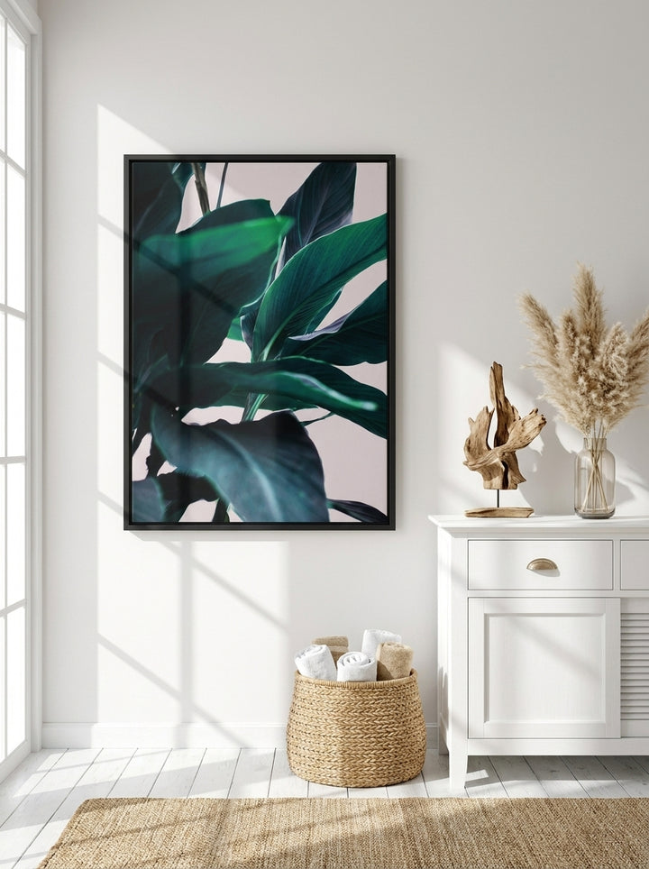 Canvas wall art with a black surround styled on the wall in a coastal bathroom