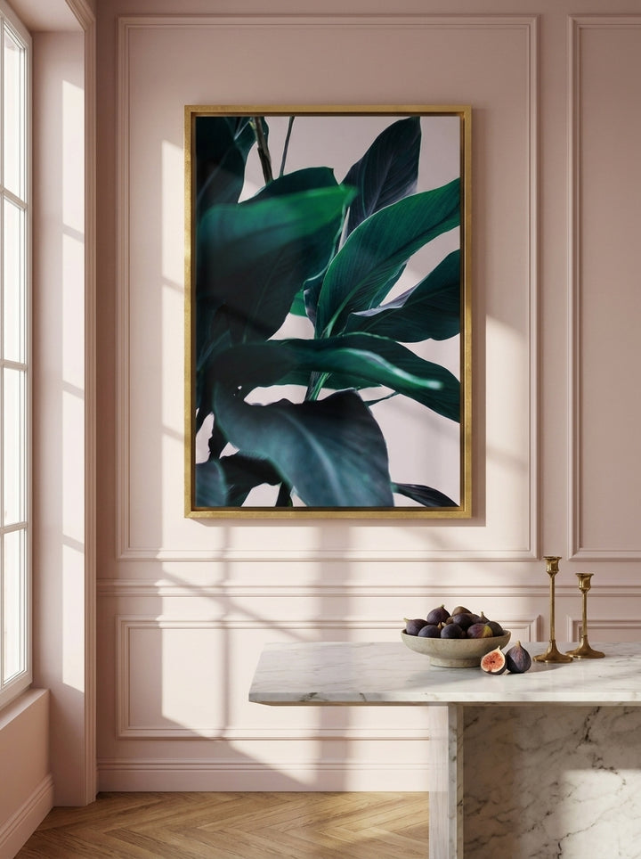 Canvas wall art with a gold leaf surround styled on the wall in a Parisian living room
