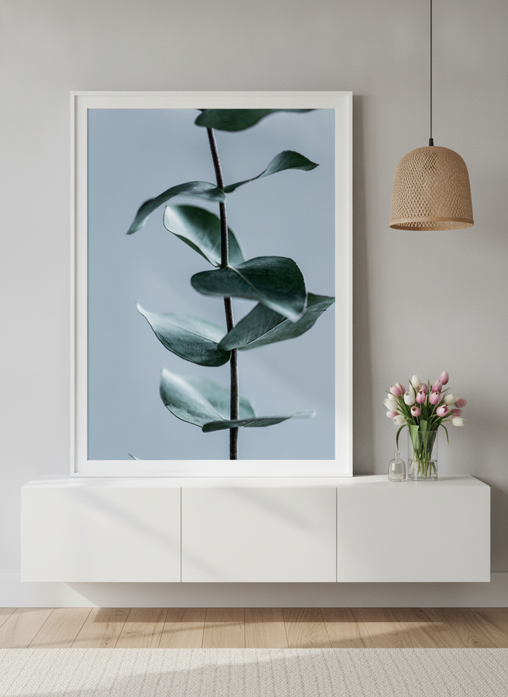 Modern wall art print standing on a sideboard in a bright Scandinavian bathroom