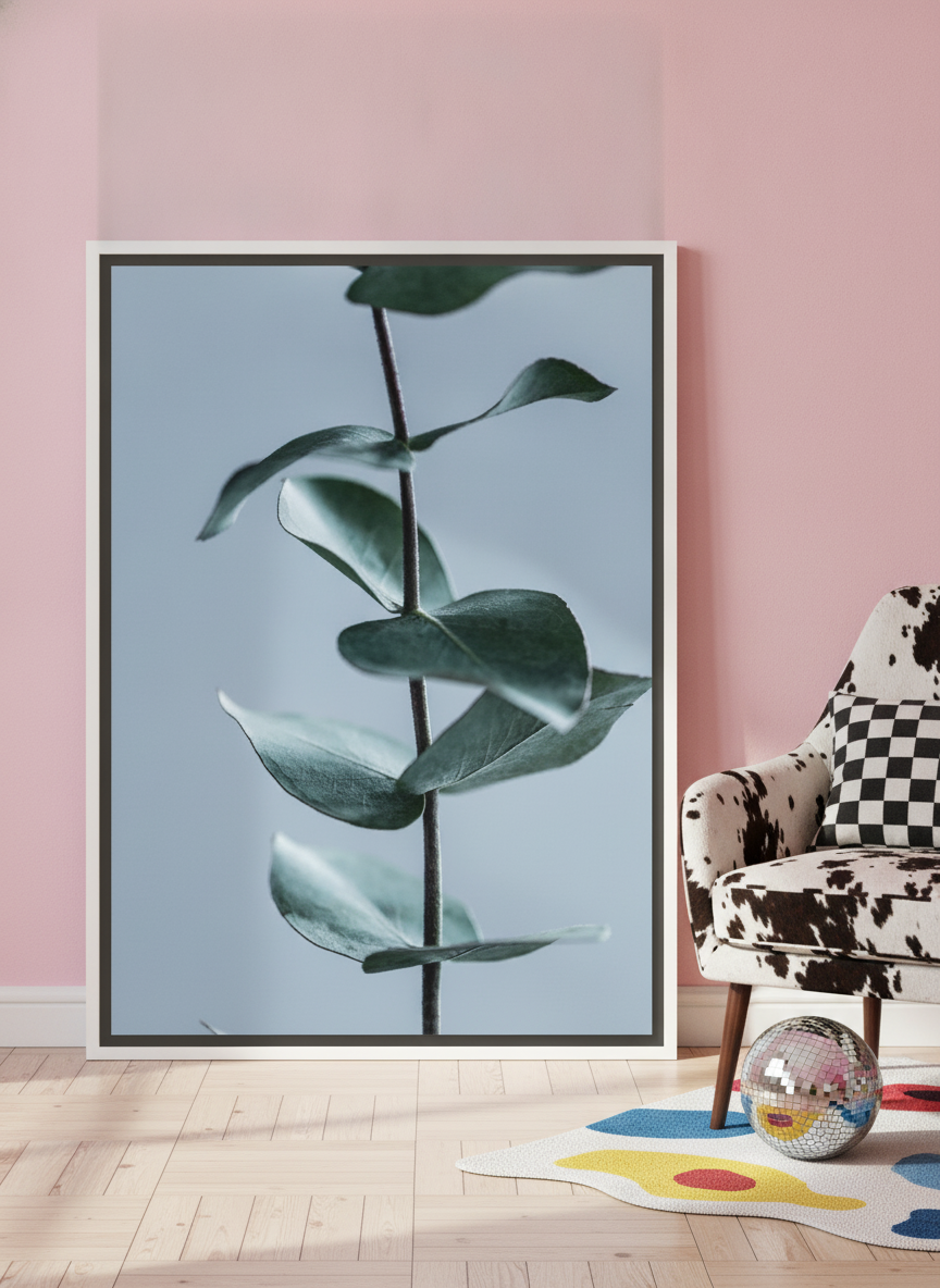 Canvas wall art with a white surround leaning against the wall in a colourful eclectic home office