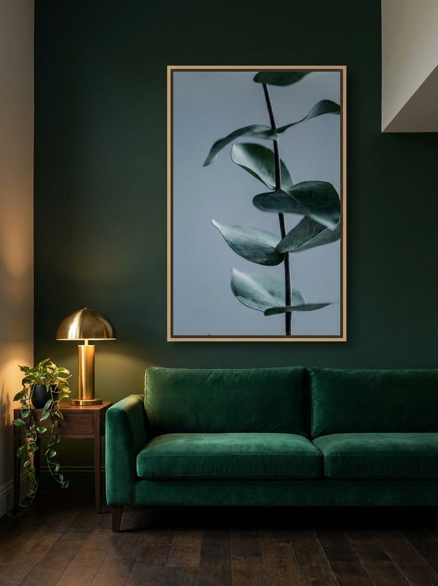 Oversized statement canvas wall art with a natural timber surround styled on the wall in a moody living room