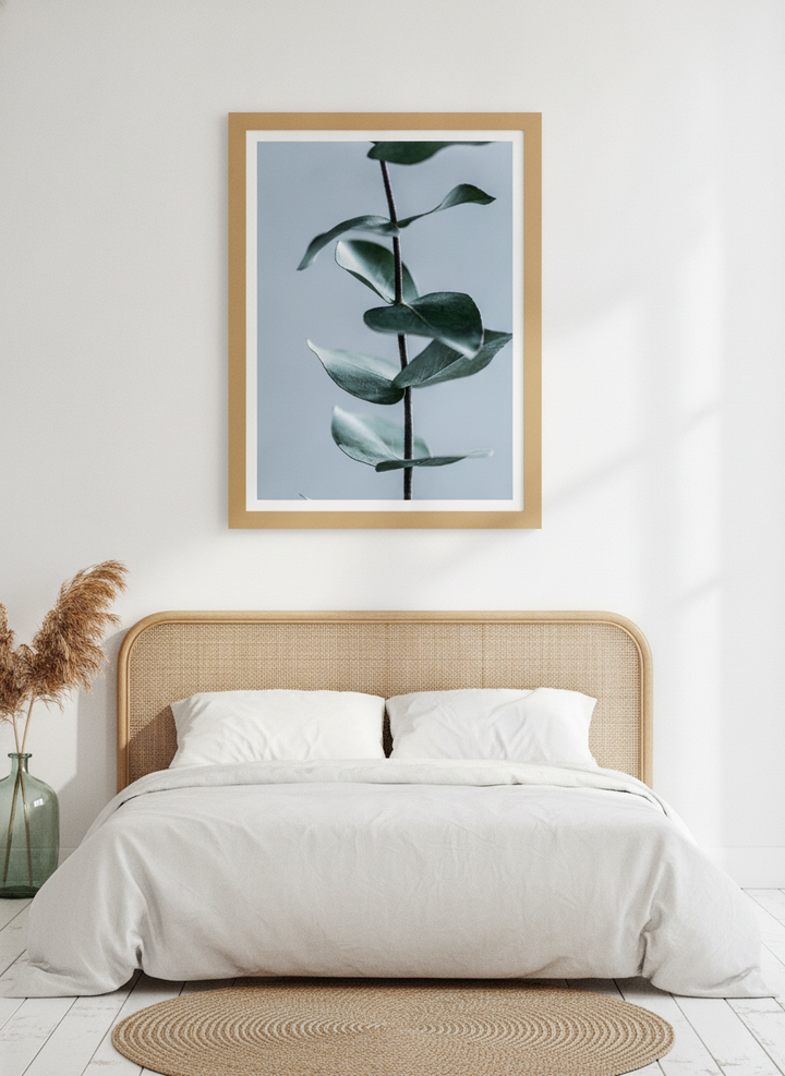 Modern wall art print styled on the wall in a coastal bedroom