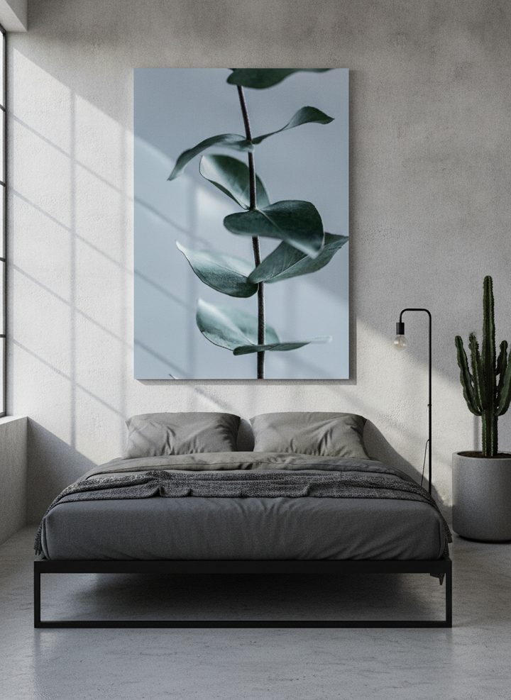 Stretched canvas wall art styled on the wall in an industrial loft bedroom
