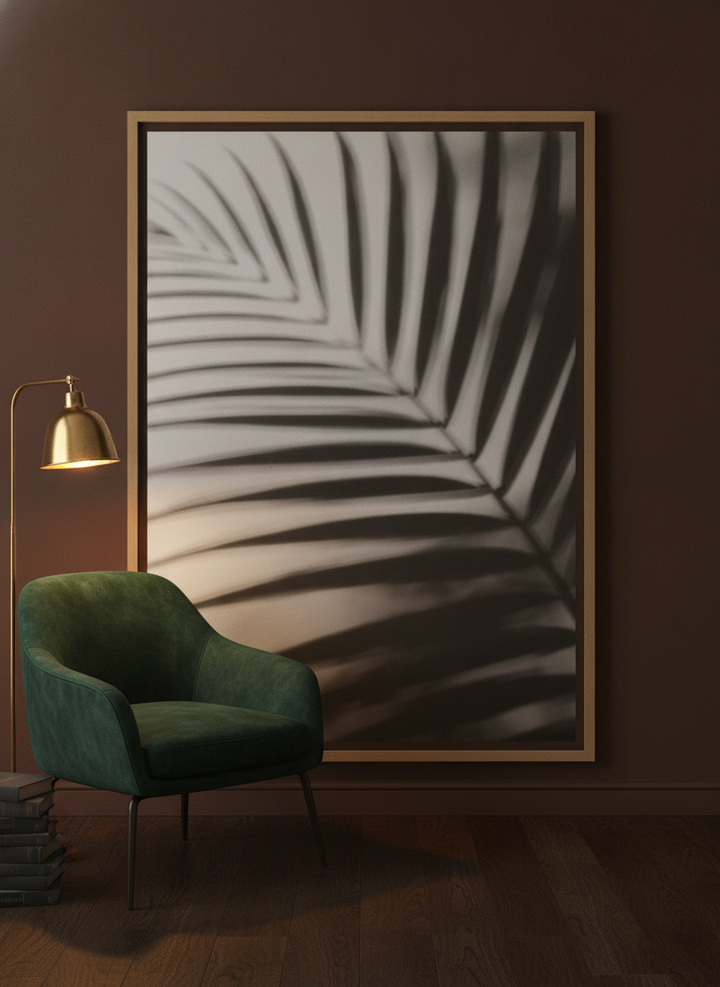 Oversized statement canvas wall art with a natural timber surround leaning against the wall in a moody home office
