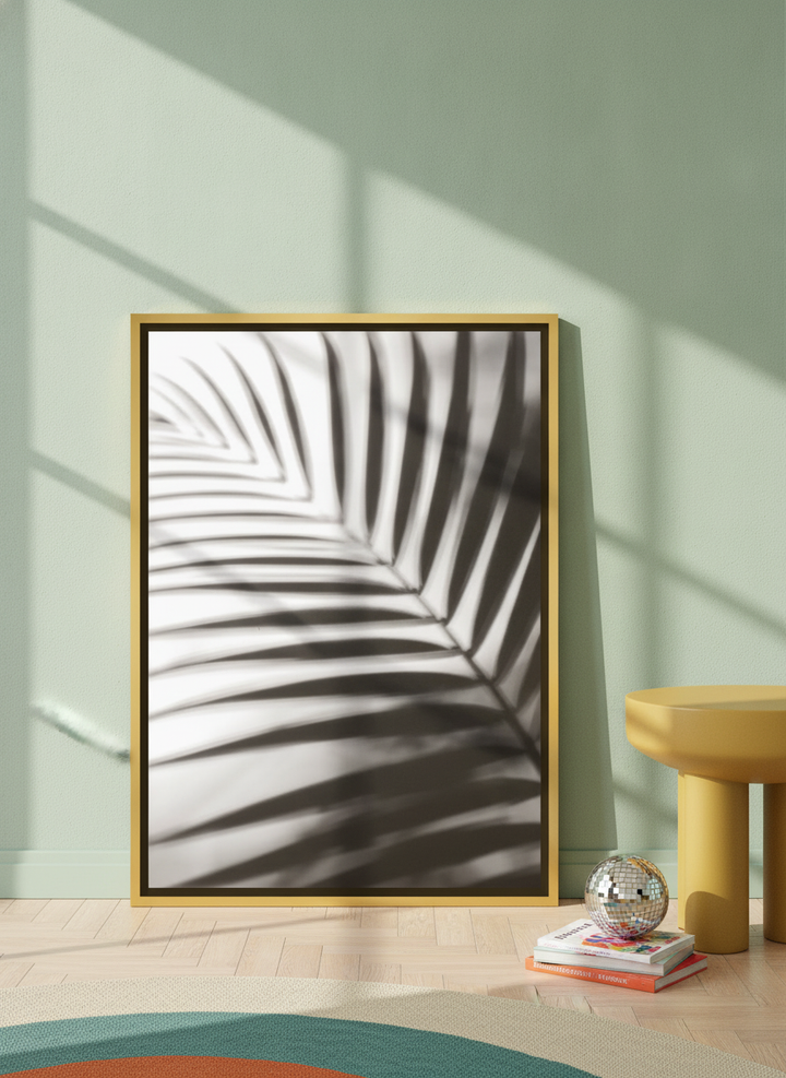 Canvas wall art with a gold leaf surround leaning against the wall in a colourful eclectic living room