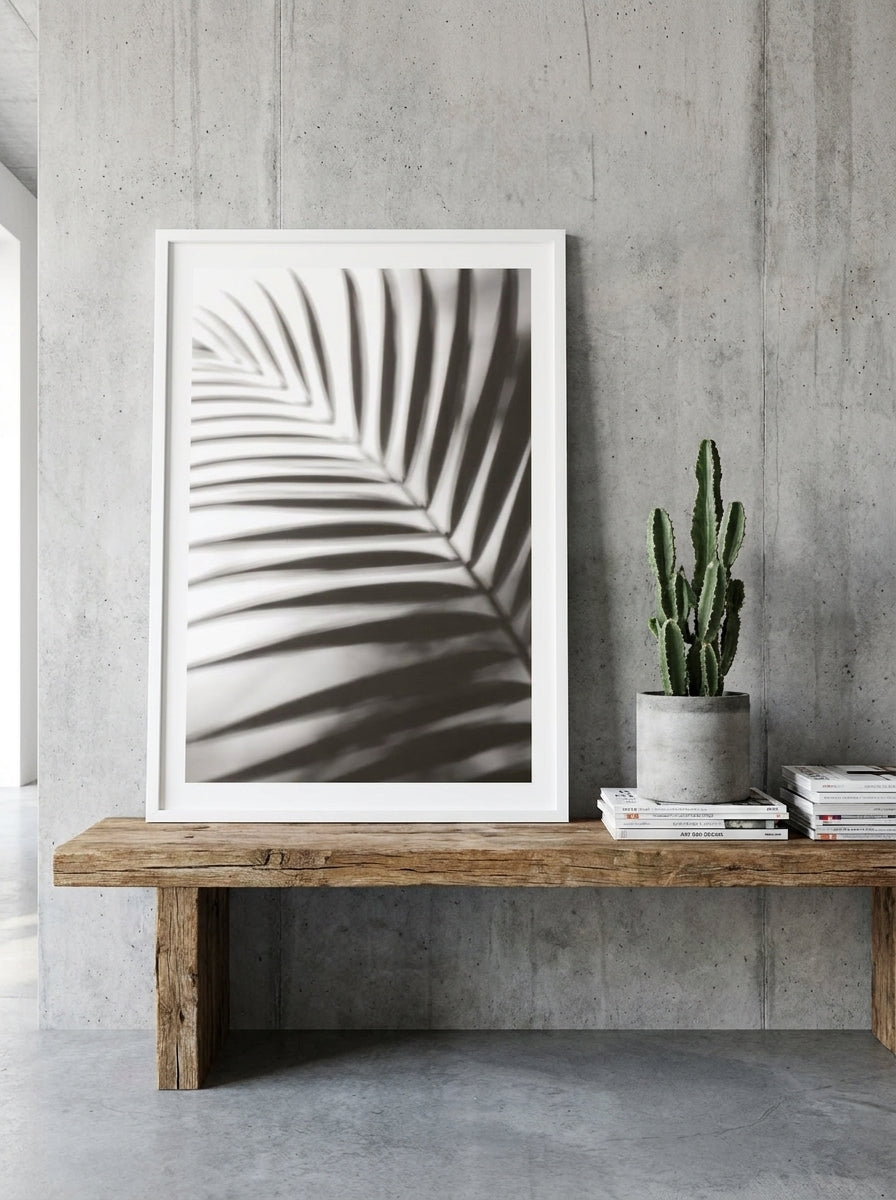 Modern wall art print standing on a bench in an industrial loft living room