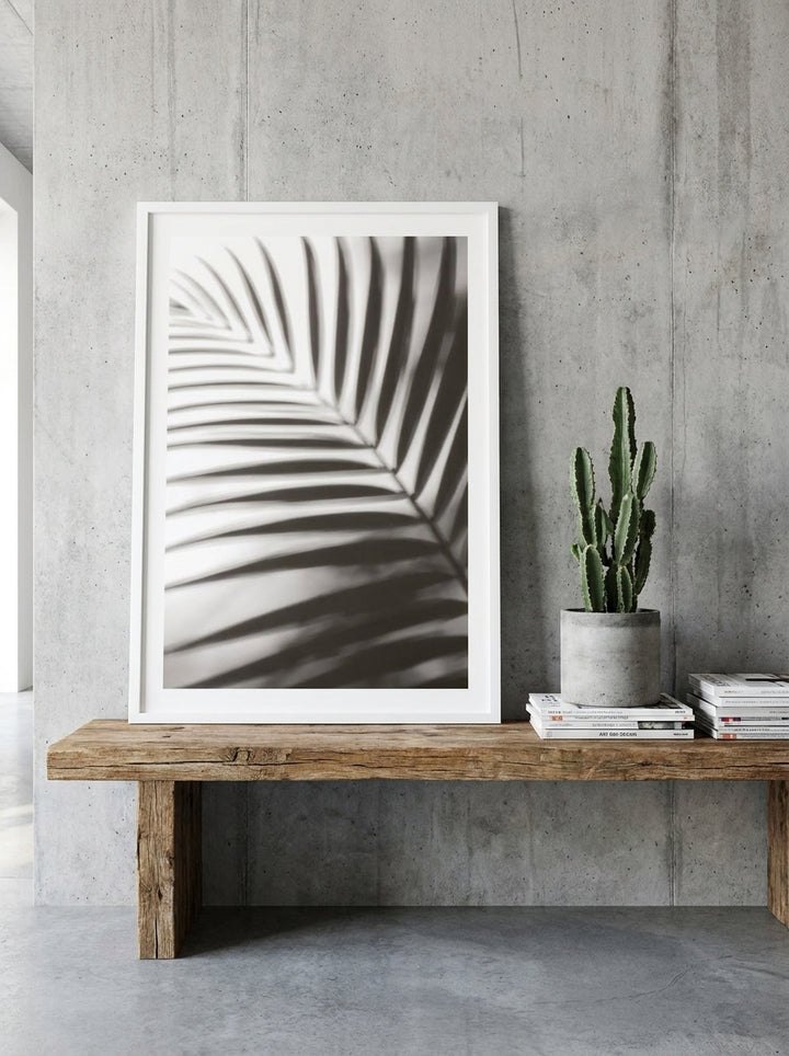 Modern wall art print standing on a bench in an industrial loft living room