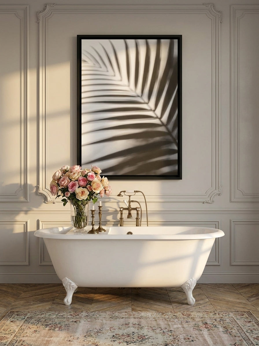 Canvas wall art with a black surround styled on the wall in a Parisian bathroom