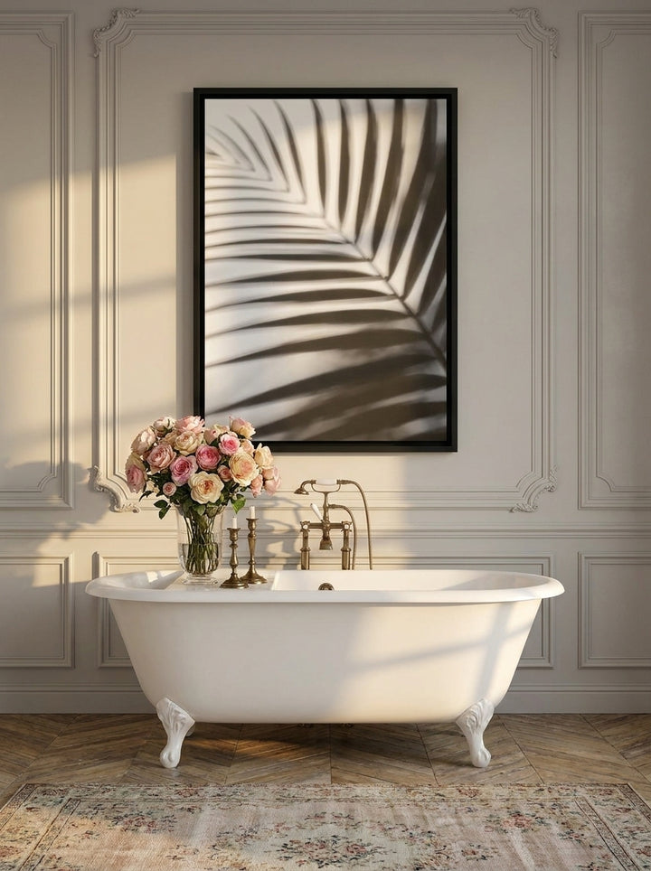 Canvas wall art with a black surround styled on the wall in a Parisian bathroom