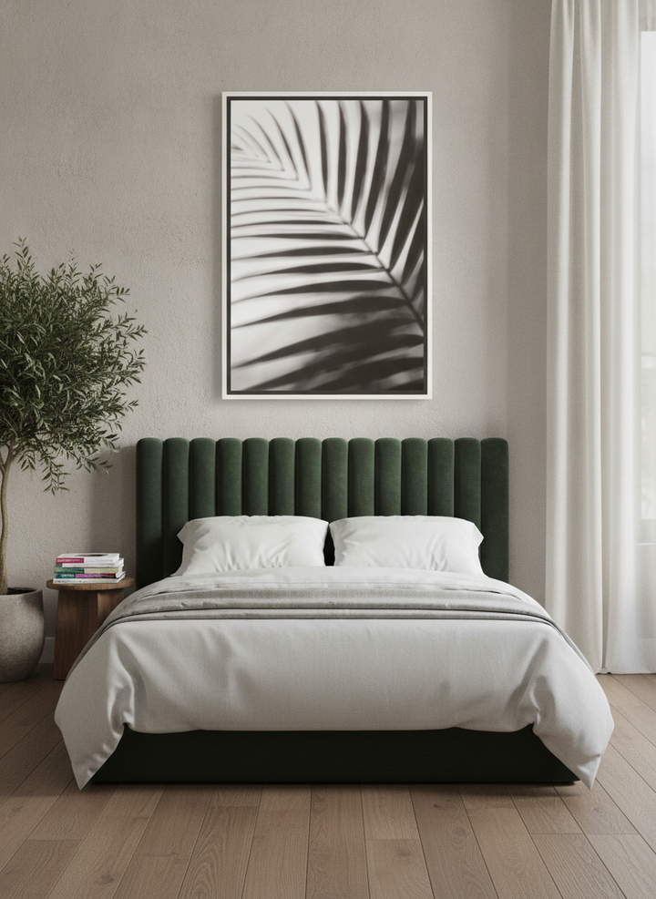 Oversized statement canvas wall art with a white surround styled on the wall in a luxe bedroom