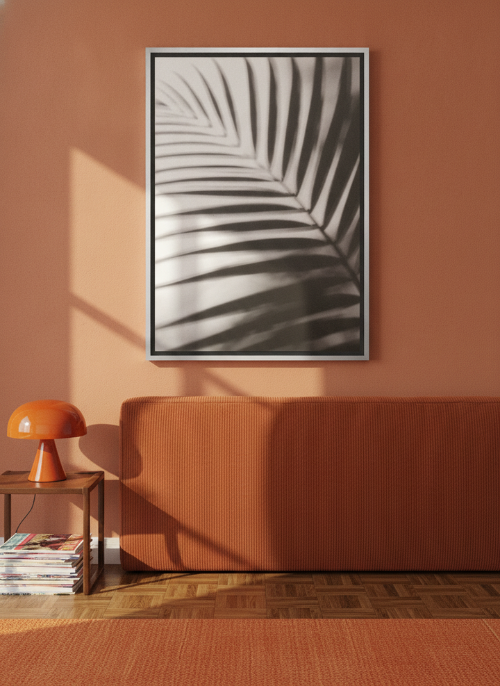 Canvas wall art with a silver leaf surround styled on the wall in a retro 70s bedroom